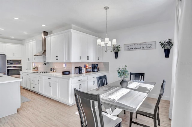 4477 Renly Ln, Clermont, FL 34711 - dining space with a chandelier, light wood finished floors, and recessed lighting