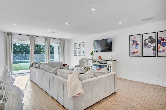 4477 Renly Ln, Clermont, FL 34711 - living area featuring light wood-style floors and recessed lighting