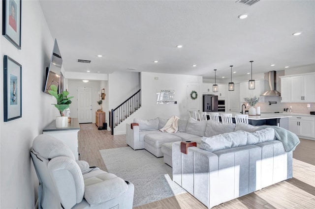 4477 Renly Ln, Clermont, FL 34711 - living room with stairway, recessed lighting, and light wood finished floors