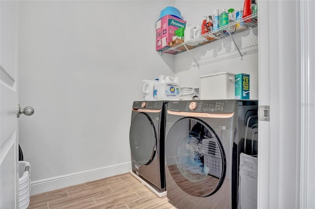 4477 Renly Ln, Clermont, FL 34711 - washroom featuring independent washer and dryer and wood finished floors