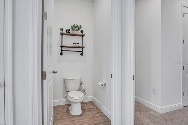 4477 Renly Ln, Clermont, FL 34711 - bathroom featuring toilet and wood finished floors