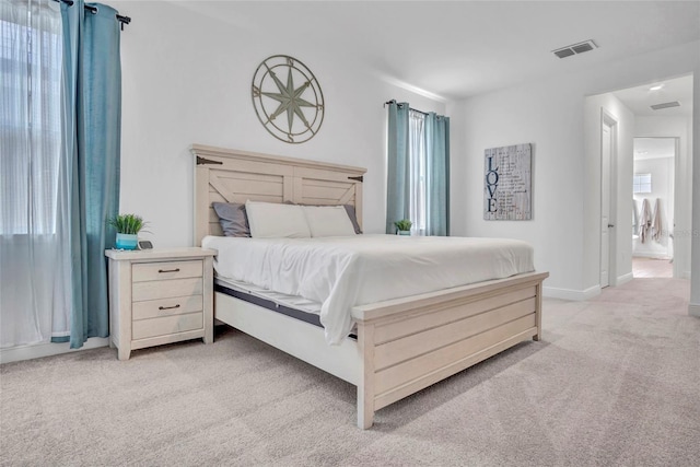 4477 Renly Ln, Clermont, FL 34711 - bedroom with light carpet and baseboards