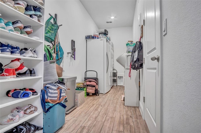 4477 Renly Ln, Clermont, FL 34711 - walk in closet featuring light wood-style flooring