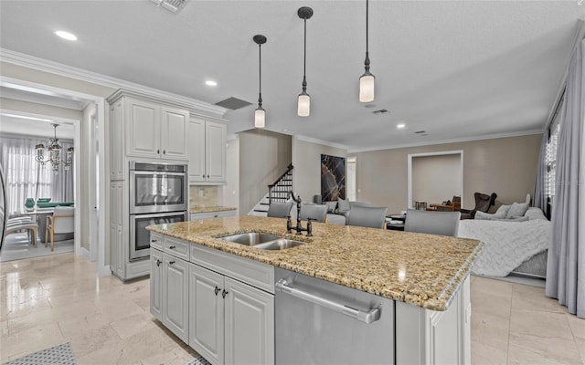 12023 Gold Creek Trl, Windermere, FL 34786 - kitchen featuring stainless steel appliances, open floor plan, a chandelier, a kitchen island with sink, and light stone countertops