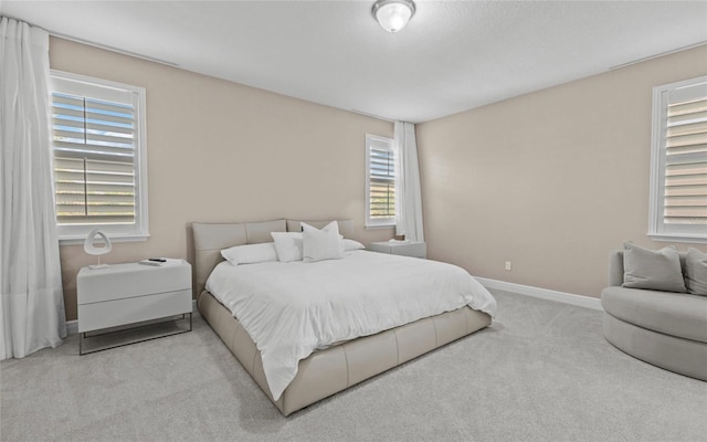 12023 Gold Creek Trl, Windermere, FL 34786 - carpeted bedroom featuring multiple windows