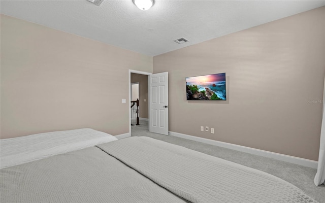 12023 Gold Creek Trl, Windermere, FL 34786 - bedroom featuring light carpet and a textured ceiling