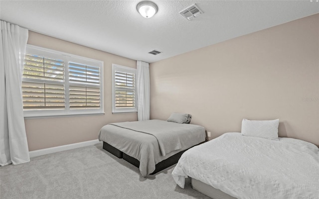 12023 Gold Creek Trl, Windermere, FL 34786 - carpeted bedroom with baseboards and a textured ceiling