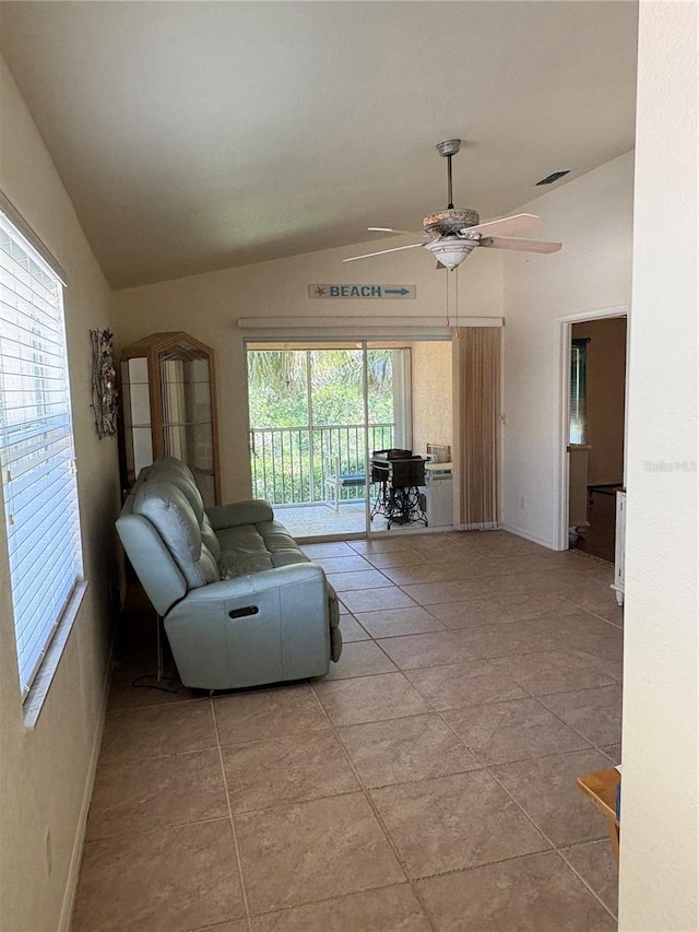 26735 Little John Ct Unit 27, Bonita Springs, FL 34135 - living room with lofted ceiling, a ceiling fan, and light tile patterned floors