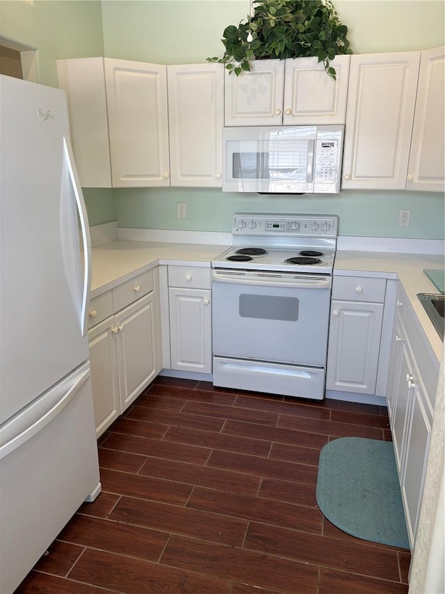 26735 Little John Ct Unit 27, Bonita Springs, FL 34135 - kitchen with white appliances, wood finish floors, and white cabinets
