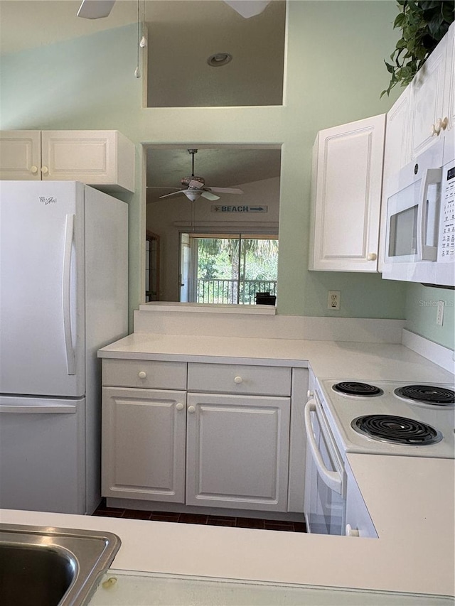 26735 Little John Ct Unit 27, Bonita Springs, FL 34135 - kitchen with a ceiling fan, white appliances, white cabinets, and light countertops