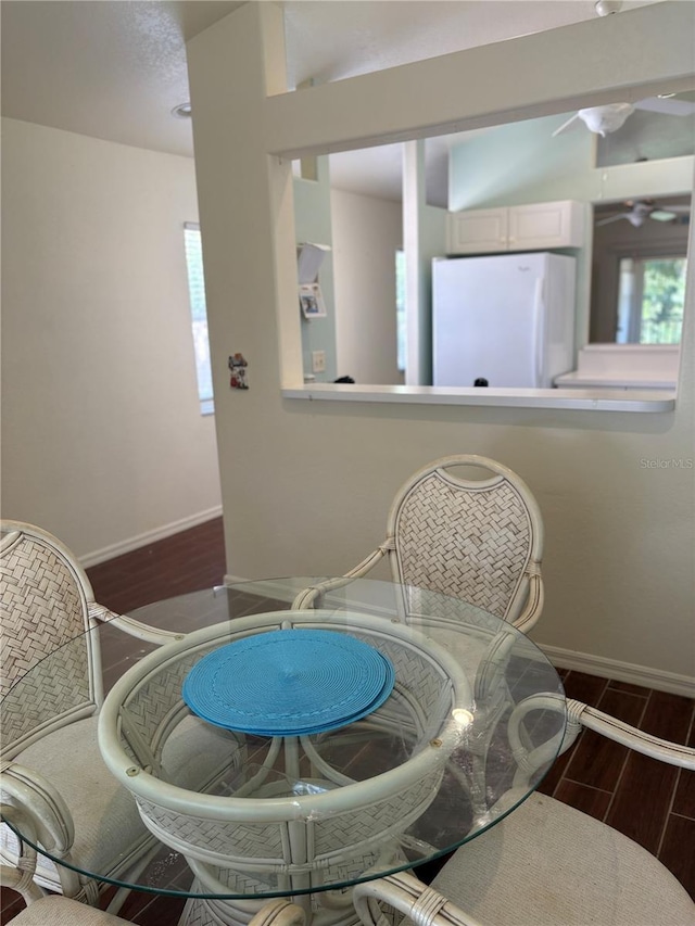 26735 Little John Ct Unit 27, Bonita Springs, FL 34135 - dining space with baseboards and wood tiled floors