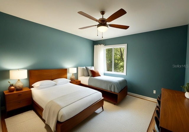 26735 Little John Ct Unit 27, Bonita Springs, FL 34135 - bedroom with a ceiling fan and light carpet