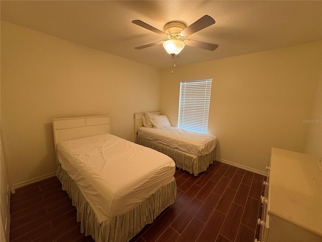 26735 Little John Ct Unit 27, Bonita Springs, FL 34135 - bedroom with dark wood finished floors and ceiling fan