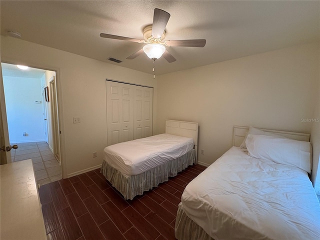 26735 Little John Ct Unit 27, Bonita Springs, FL 34135 - bedroom with a closet, wood finished floors, and a ceiling fan