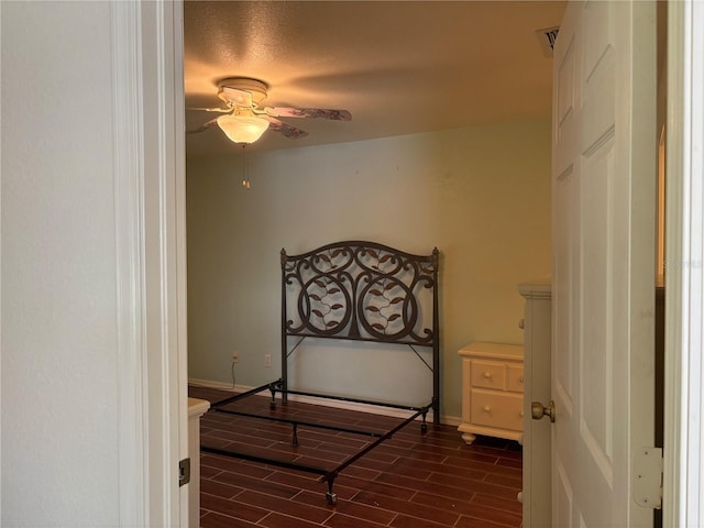 26735 Little John Ct Unit 27, Bonita Springs, FL 34135 - bedroom with wood tiled floors and a ceiling fan