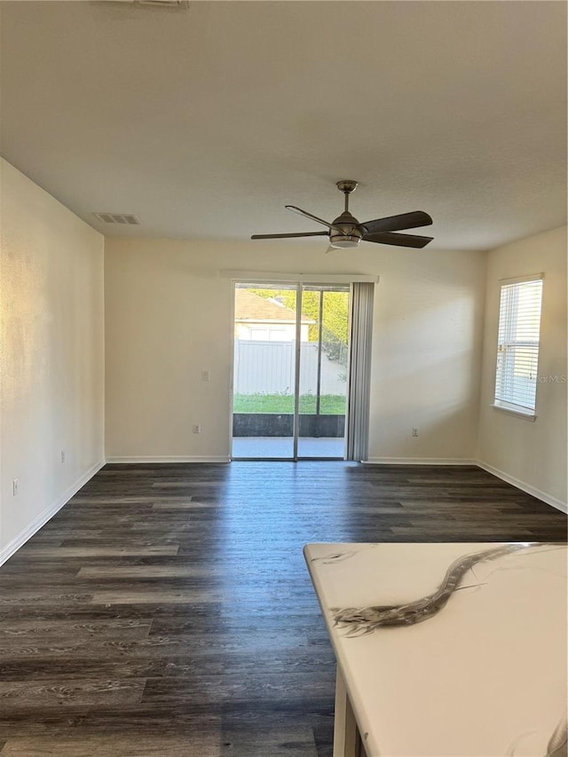 1954 Marabou Dr, Davenport, FL 33896 - unfurnished room with dark wood-type flooring and ceiling fan