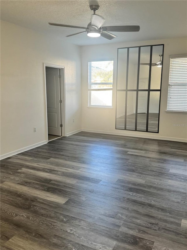 1954 Marabou Dr, Davenport, FL 33896 - empty room featuring a ceiling fan, dark wood finished floors, and a textured ceiling