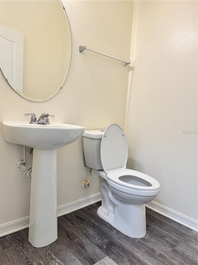 1954 Marabou Dr, Davenport, FL 33896 - half bathroom with wood finished floors and toilet