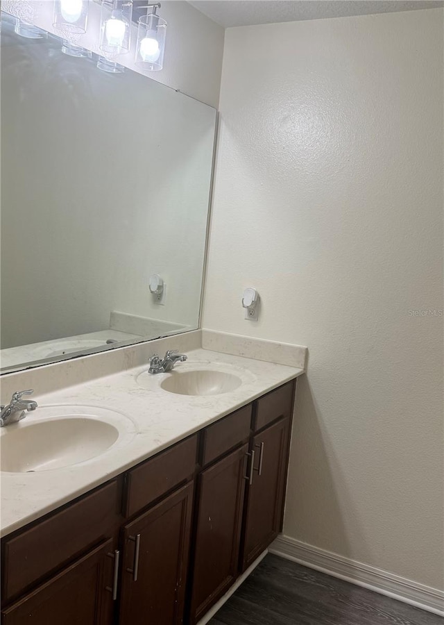 1954 Marabou Dr, Davenport, FL 33896 - bathroom with double vanity and wood finished floors
