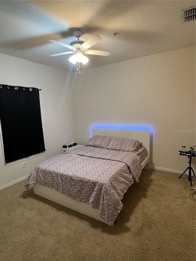 3593 Conroy Rd Unit 416, Orlando, FL 32839 - carpeted bedroom featuring baseboards and a ceiling fan