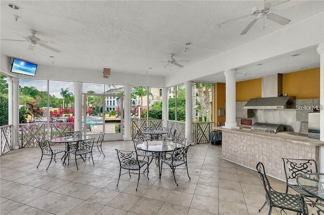 3593 Conroy Rd Unit 416, Orlando, FL 32839 - sunroom / solarium with decorative columns, a textured ceiling, and tile patterned floors