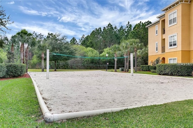 3593 Conroy Rd Unit 416, Orlando, FL 32839 - surrounding community featuring volleyball court, a yard, and view of wooded area