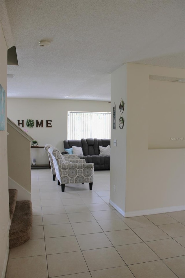 1533 Blue Sky Way, Clermont, FL 34714 - living area with light tile patterned floors, stairway, and a textured ceiling