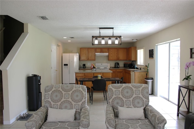 1533 Blue Sky Way, Clermont, FL 34714 - living room with plenty of natural light, light tile patterned floors, and a textured ceiling
