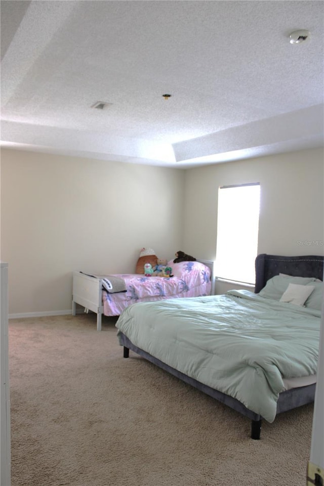 1533 Blue Sky Way, Clermont, FL 34714 - bedroom featuring carpet floors, a textured ceiling, and a skylight
