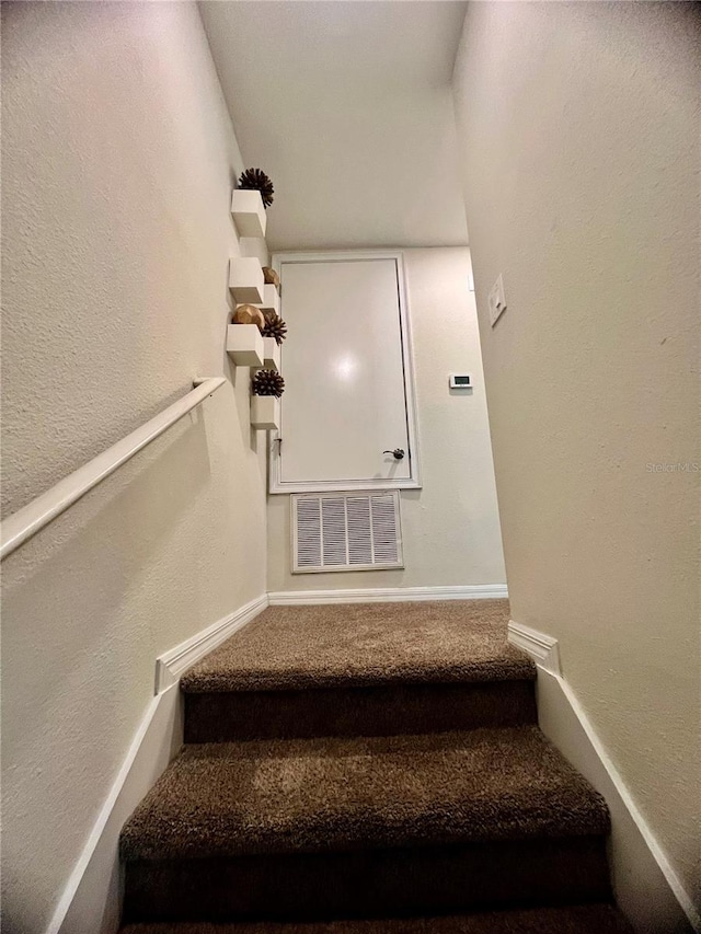 3191 Pequod Pl, Kissimmee, FL 34746 - stairway with carpet and baseboards