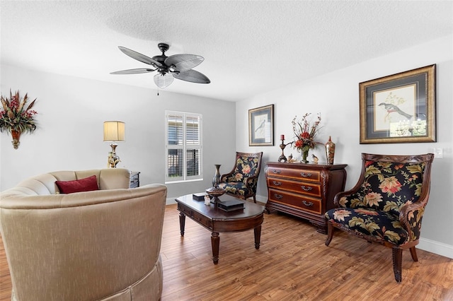 43 Pergola Pl, Ormond Beach, FL 32174 - living area featuring wood finished floors, a ceiling fan, and a textured ceiling
