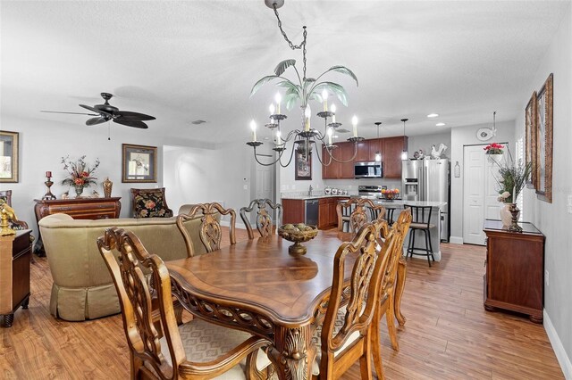 43 Pergola Pl, Ormond Beach, FL 32174 - dining area featuring light wood-type flooring, a chandelier, ceiling fan, and recessed lighting