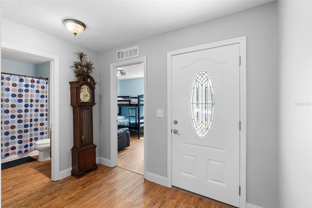 43 Pergola Pl, Ormond Beach, FL 32174 - foyer entrance with light wood finished floors and baseboards