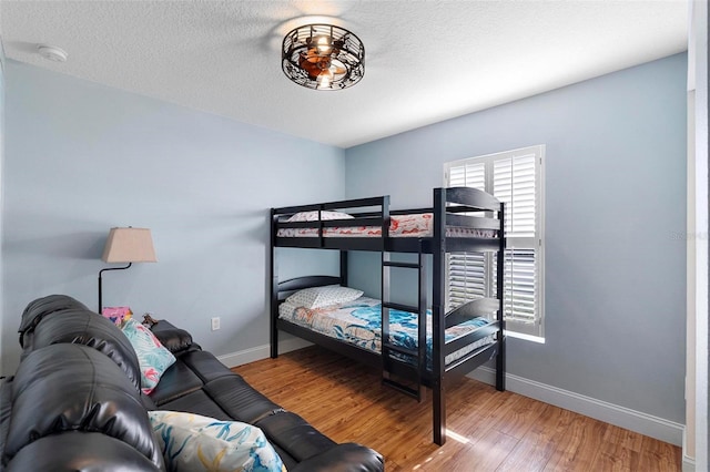 43 Pergola Pl, Ormond Beach, FL 32174 - bedroom with wood finished floors and a textured ceiling