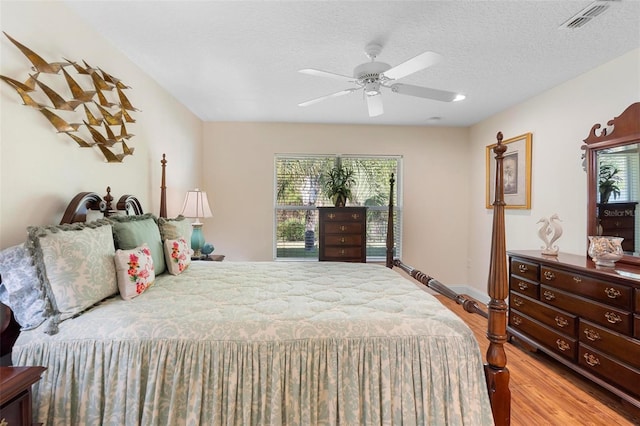 43 Pergola Pl, Ormond Beach, FL 32174 - bedroom featuring wood finished floors, ceiling fan, and a textured ceiling