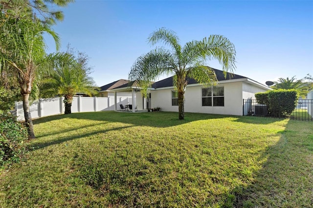 43 Pergola Pl, Ormond Beach, FL 32174 - rear view of house featuring stucco siding and a fenced backyard