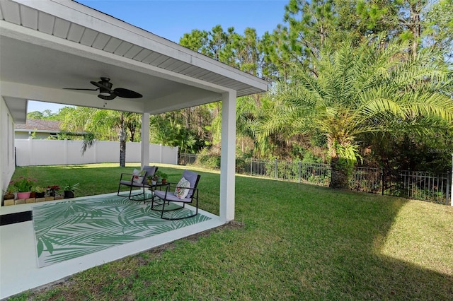 43 Pergola Pl, Ormond Beach, FL 32174 - fenced backyard with a ceiling fan and a patio