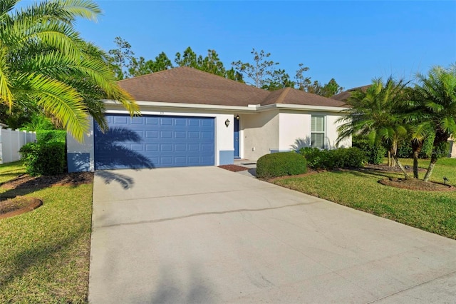 43 Pergola Pl, Ormond Beach, FL 32174 - view of front of home featuring an attached garage, concrete driveway, stucco siding, and a front yard