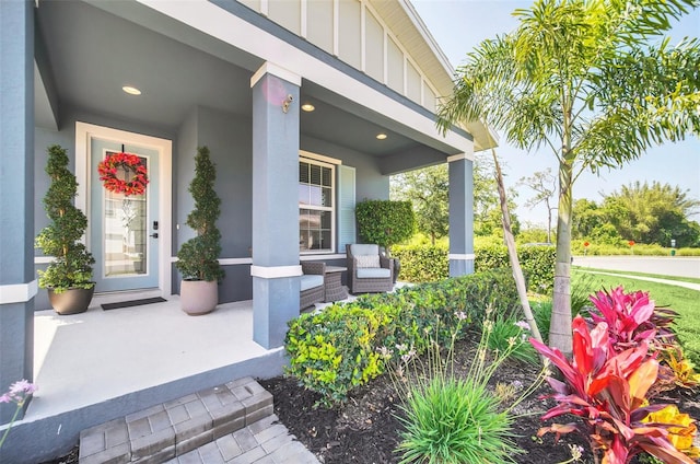 6926 Cucamelon Ct, Windermere, FL 34786 - view of exterior entry featuring covered porch and board and batten siding