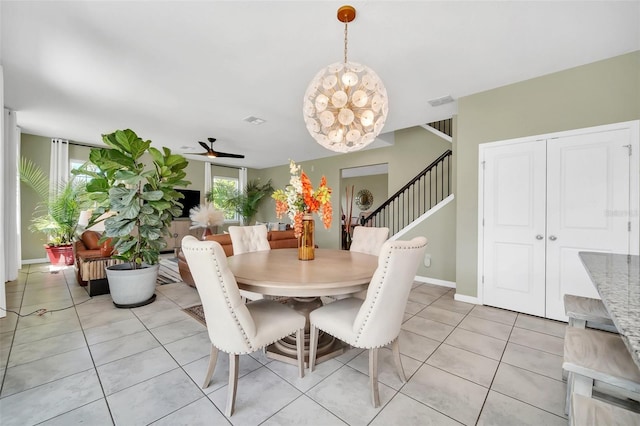 6926 Cucamelon Ct, Windermere, FL 34786 - dining space with stairs, light tile patterned floors, and a ceiling fan
