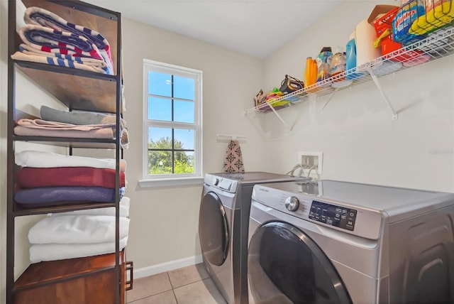 6926 Cucamelon Ct, Windermere, FL 34786 - laundry room featuring separate washer and dryer and light tile patterned floors