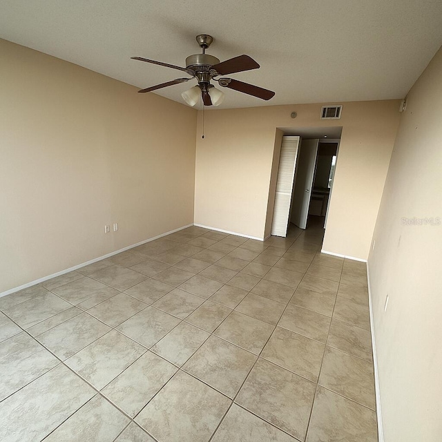 2333 Feather Sound Dr Unit C509, Clearwater, FL 33762 - empty room with a ceiling fan and light tile patterned flooring