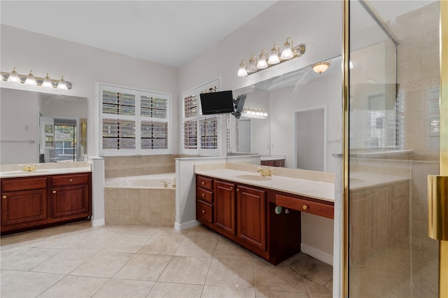 10642 Masters Dr, Clermont, FL 34711 - full bath featuring two vanities, a bath, a stall shower, and tile patterned floors