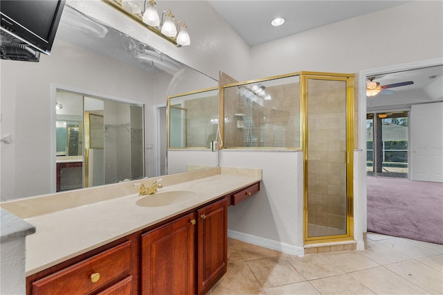 10642 Masters Dr, Clermont, FL 34711 - full bathroom with tile patterned flooring, vanity, a stall shower, and a ceiling fan