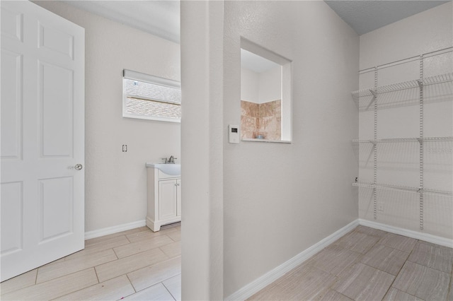 10642 Masters Dr, Clermont, FL 34711 - hallway featuring baseboards and wood tiled floors