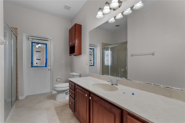 10642 Masters Dr, Clermont, FL 34711 - bathroom featuring vanity, a shower stall, and tile patterned floors