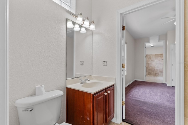 10642 Masters Dr, Clermont, FL 34711 - bathroom featuring vanity, a textured wall, and ceiling fan