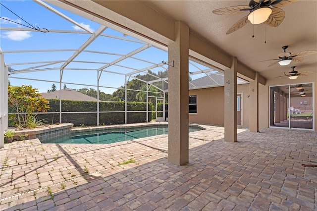 10642 Masters Dr, Clermont, FL 34711 - view of swimming pool with a ceiling fan, a patio, and glass enclosure