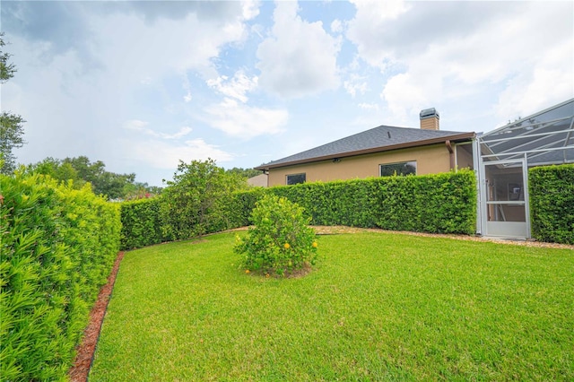10642 Masters Dr, Clermont, FL 34711 - view of green lawn featuring a lanai
