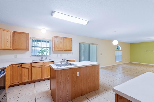 2670 S Palmetto Ridge Cir, Apopka, FL 32712 - kitchen with light tile patterned floors, a center island with sink, light countertops, stainless steel electric stove, and hanging light fixtures